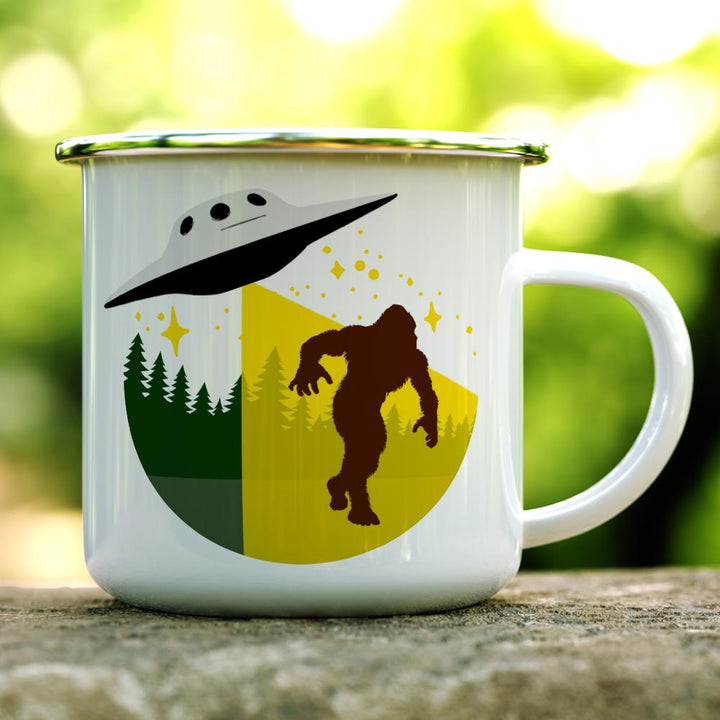 Bigfoot Abduction Camp Mug on a log