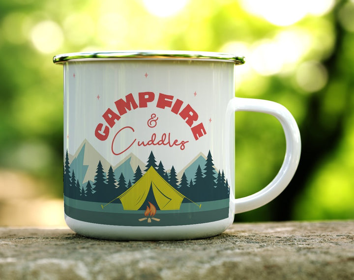 Campfire and Cuddles Camp Mug on a log