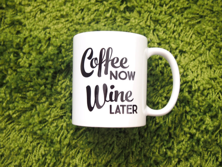 Coffee Now Wine Later Mug on green carpet