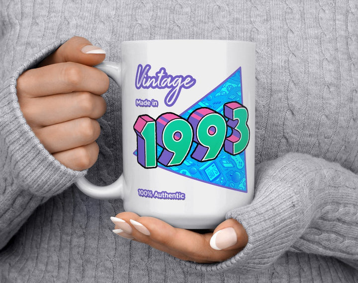 Custom Birth Year 1990's Retro Coffee Mug being held by woman in grey sweater