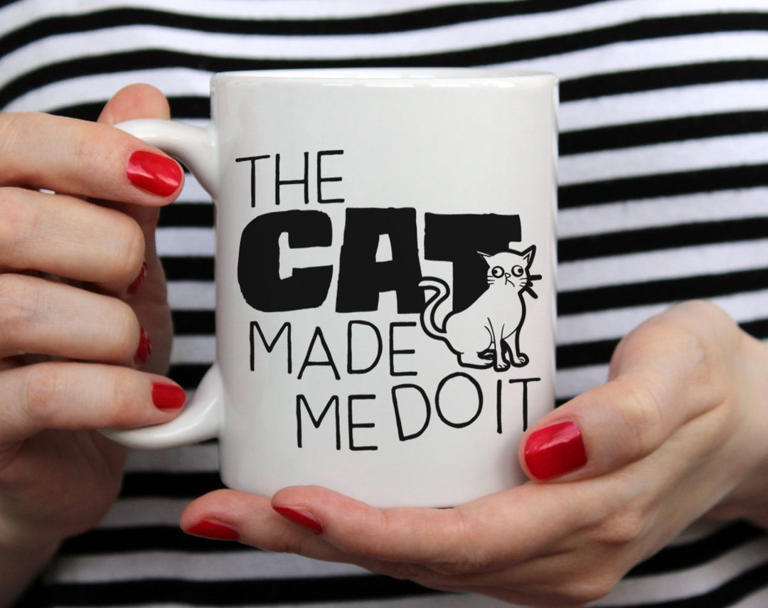 The Cat Made Me Do It Mug held by hands - Loftipop