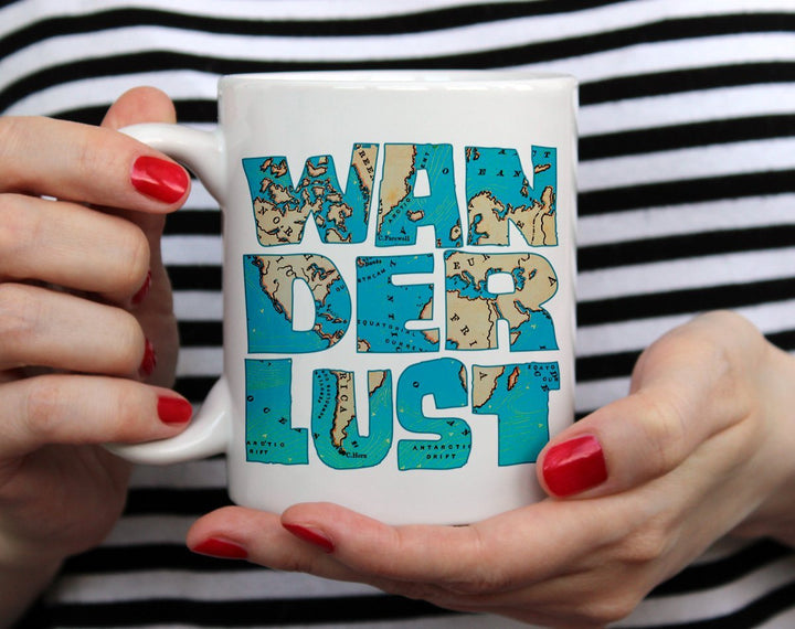 Wanderlust Mug held by hands - Loftipop